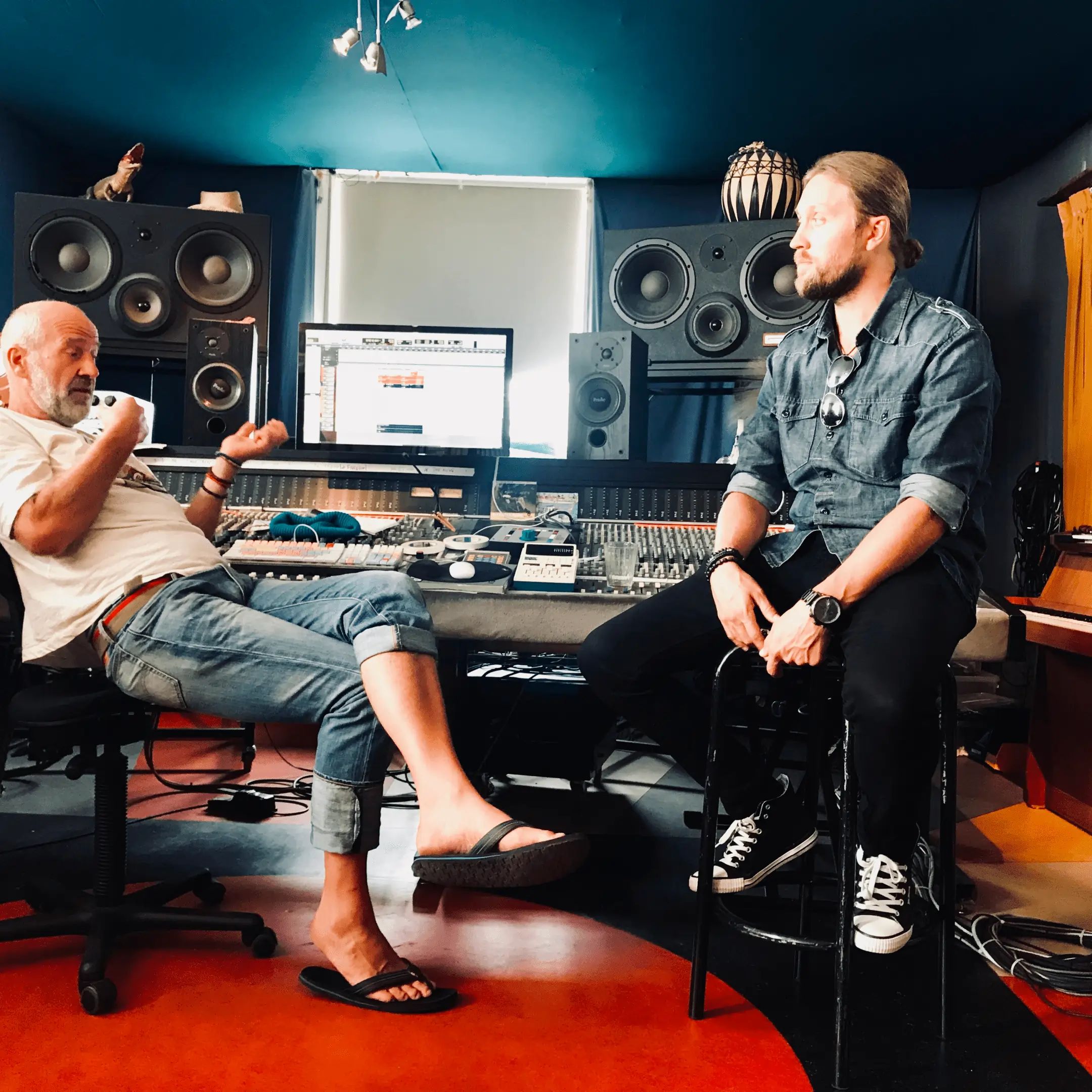 Two men in the a studio recording the single Breakaway